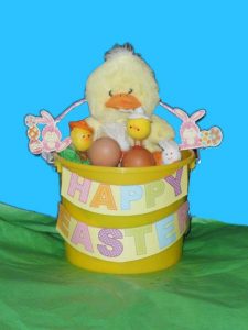 Yellow plastic bucket decorated for Easter